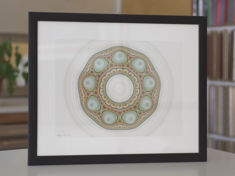 Rational function art. A print of the mandala fractal Shells, in pastel colours on a grey background, a Julia set.